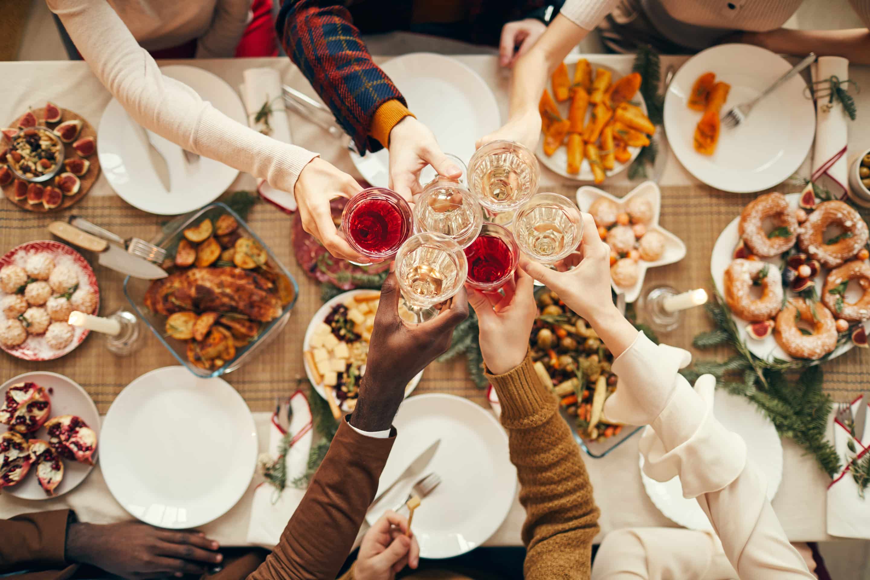 Celebration Toast over Festive Dinner Table - Keto Social Events